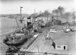 Ship Iron Knob at the BHP Steelworks wharf at Newcastle, circa 1930s.