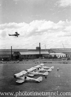 Avro Cadet aircraft at Newcastle Aero Club, 1940s, with Goninan engineering in the background.