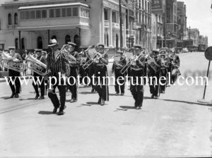 Brass band marching in Hunter Street East, Newcastle, NSW, circa 1940s.