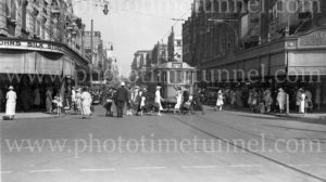 Shoppers crossing Hunter Street at Scotts Corner, Newcastle, NSW, circa 1940s.