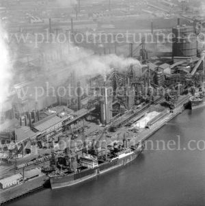 Aerial view of the BHP steelworks wharf, Newcastle, NSW, showing the ship Iron Wyndham, March 31, 1968.