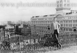 Young man on the roof of the Peoples’ Palace, Sydney, with Anthony Hordern’s building in the background. June 10, 1961.